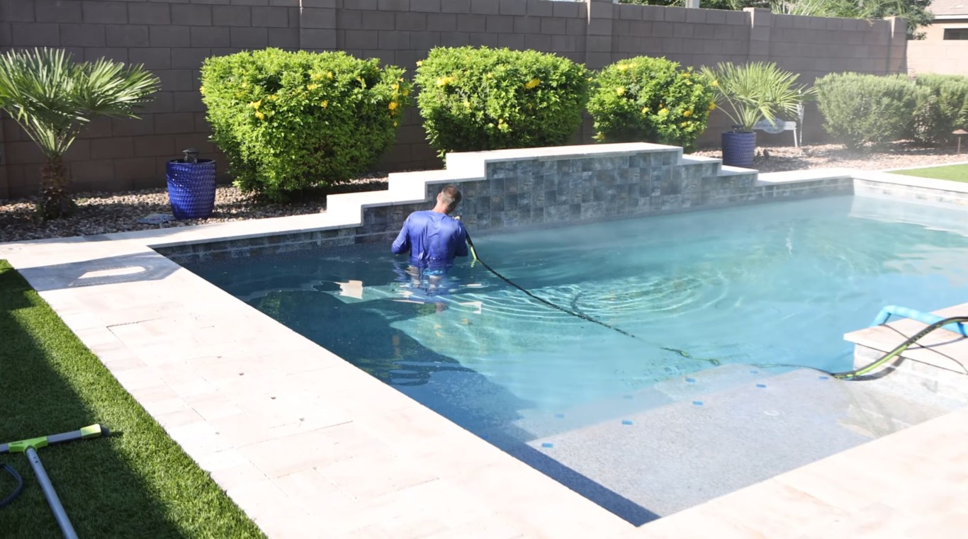 Professional technician providing weekly pool cleaning service in Indio, CA